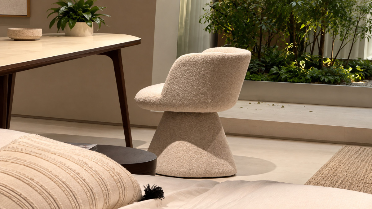 Cream upholstered dining chair beside a table in a furniture showroom