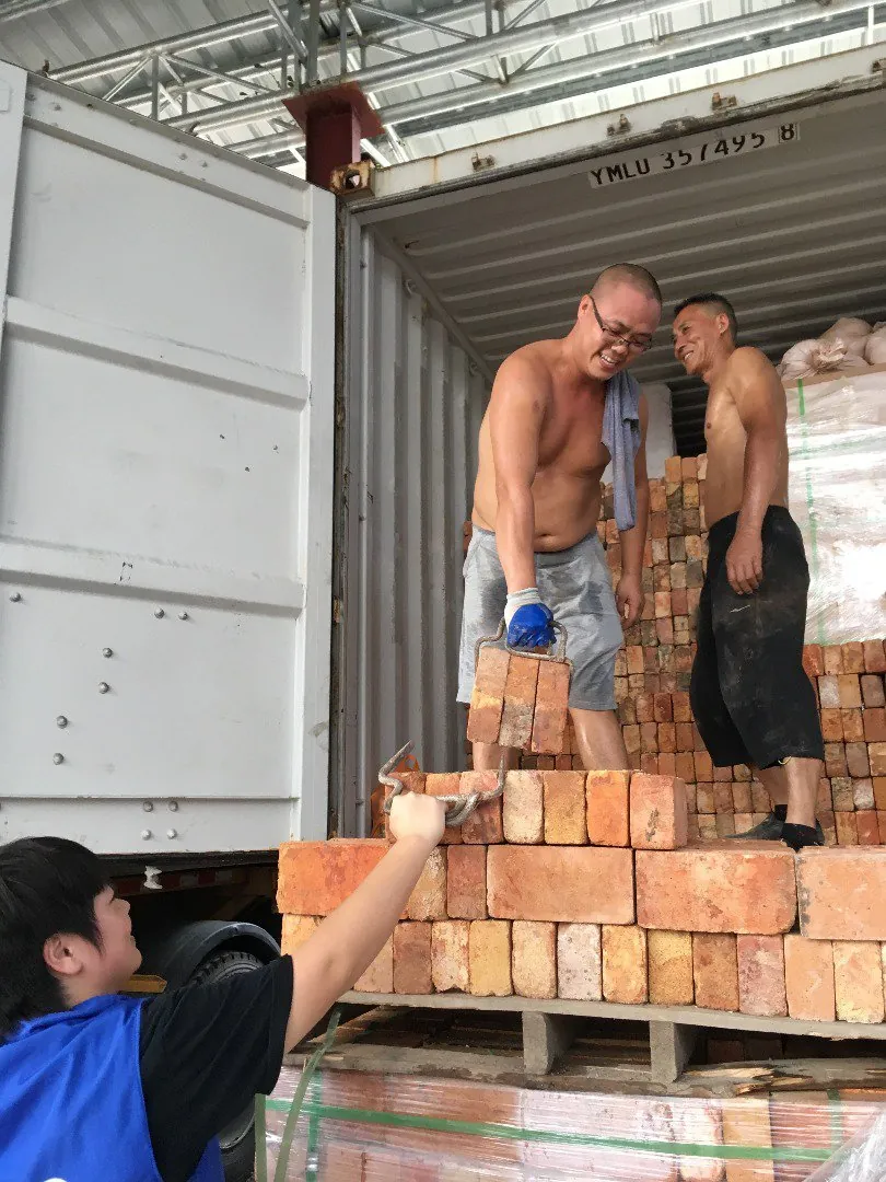 Loading cartons into a container